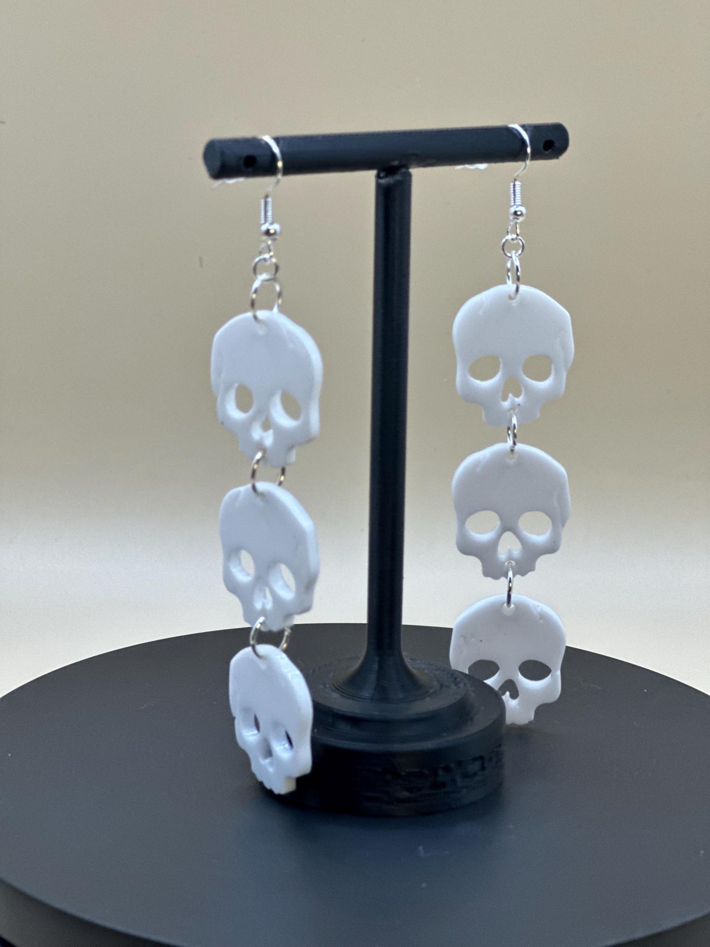 Stacked Skulls Dangle Earrings: Steel & Resin