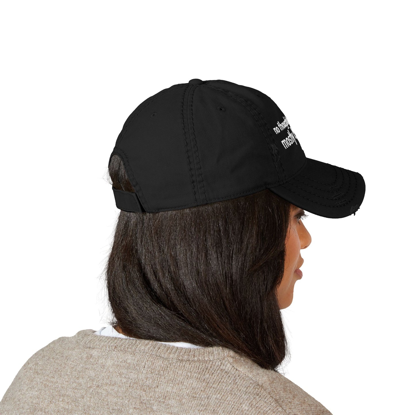 Distressed ball cap embroidered with “no thoughts just vibes mostly bad ones”.