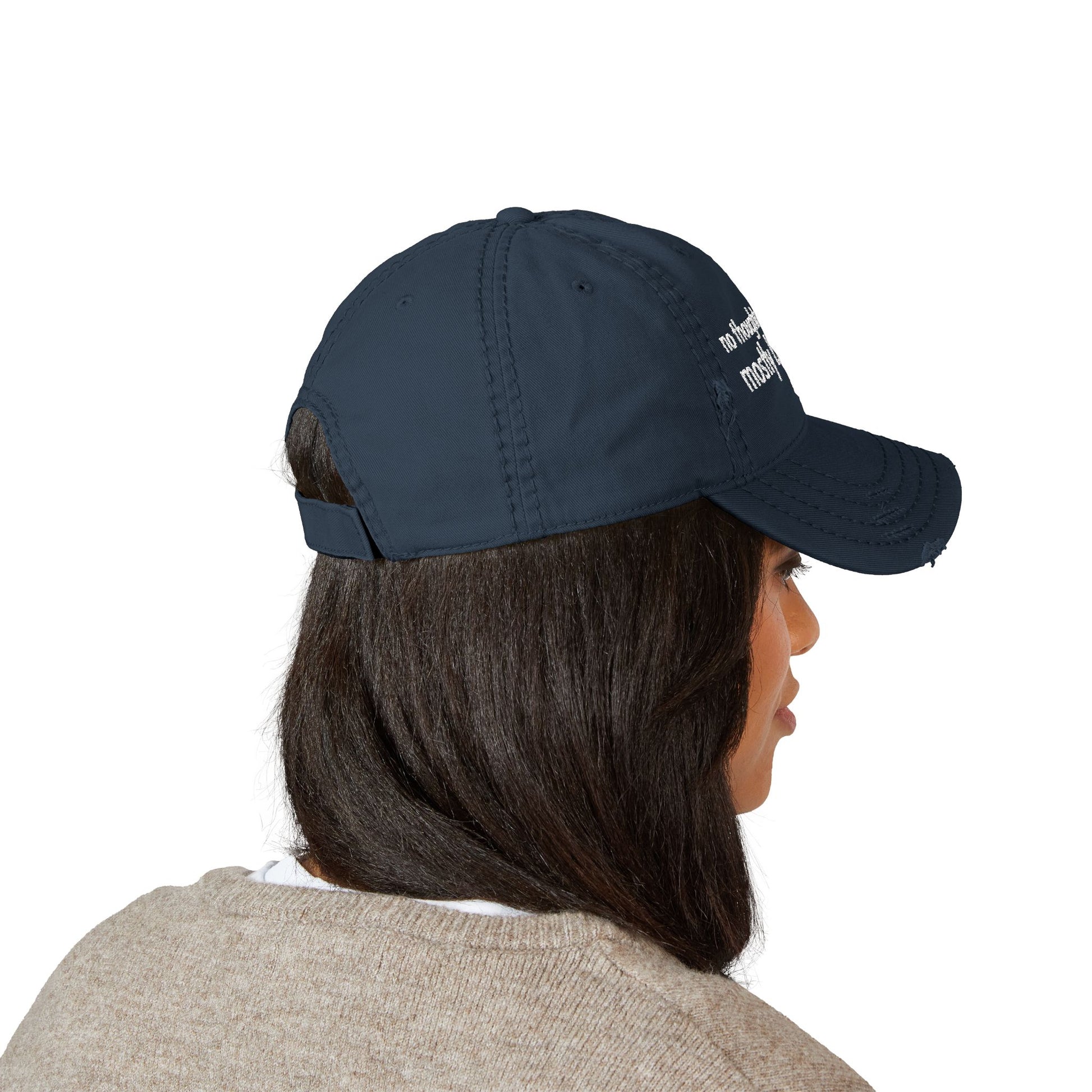 Distressed ball cap embroidered with “no thoughts just vibes mostly bad ones”.
