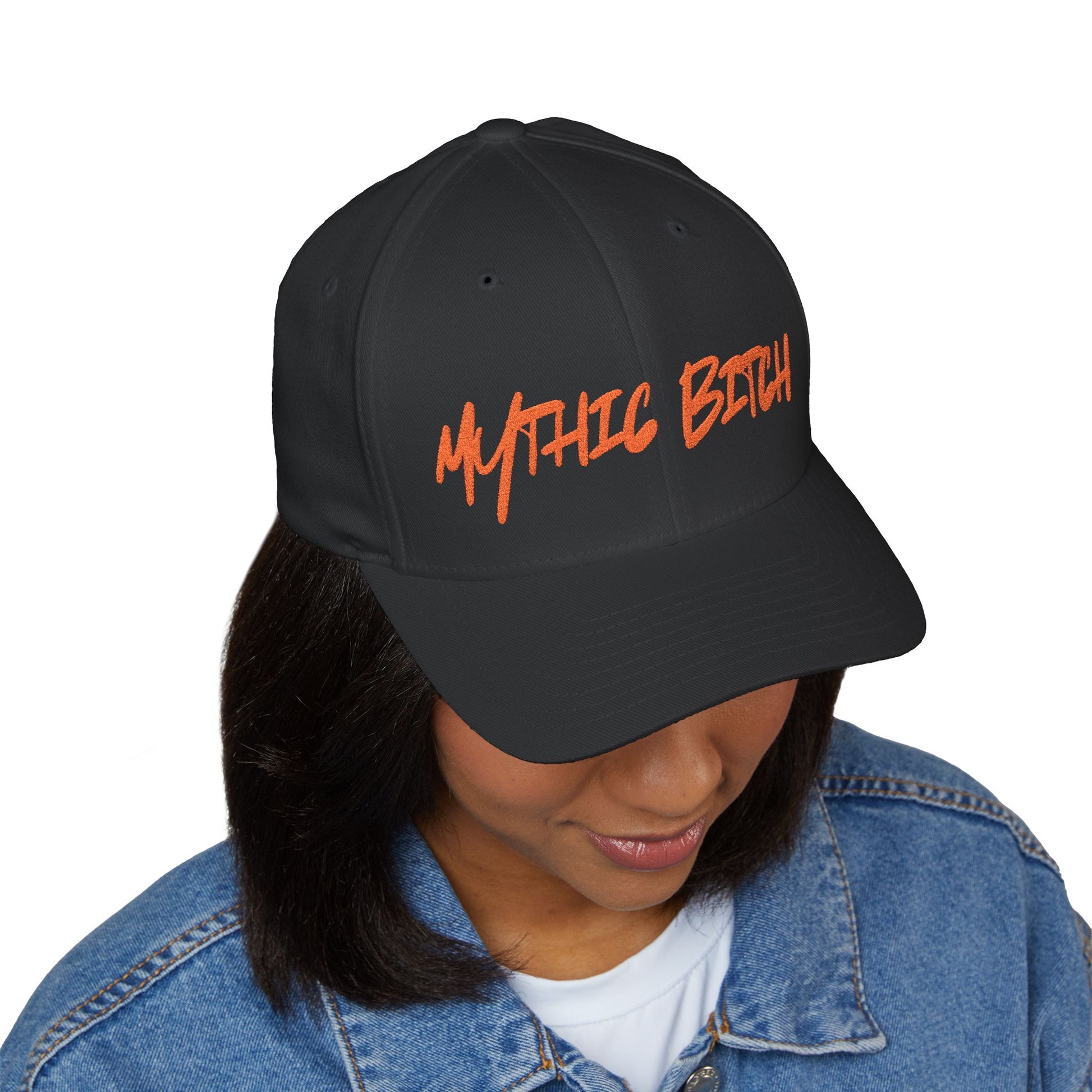 Baseball cap embroidered with “mythic bitch”.