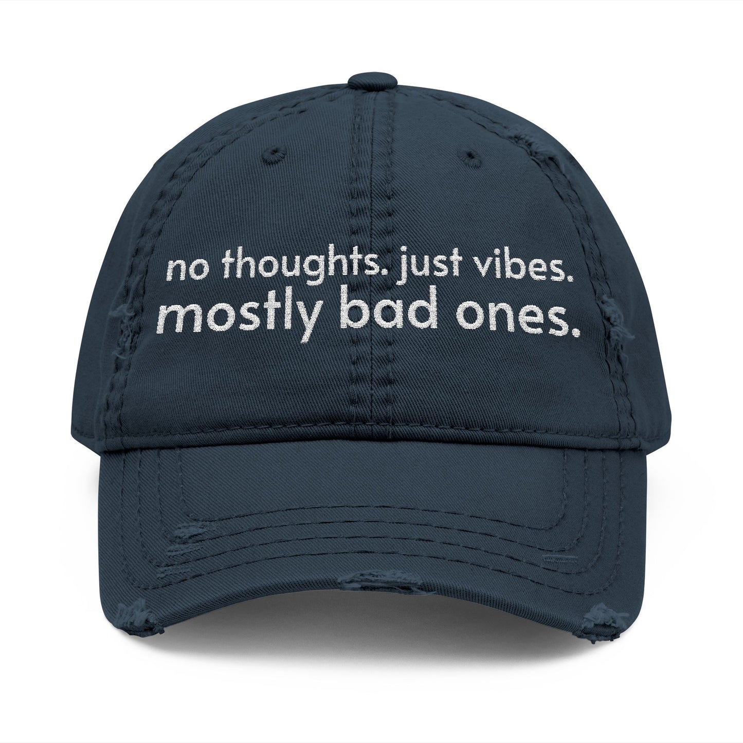 Distressed ball cap embroidered with “no thoughts just vibes mostly bad ones”.