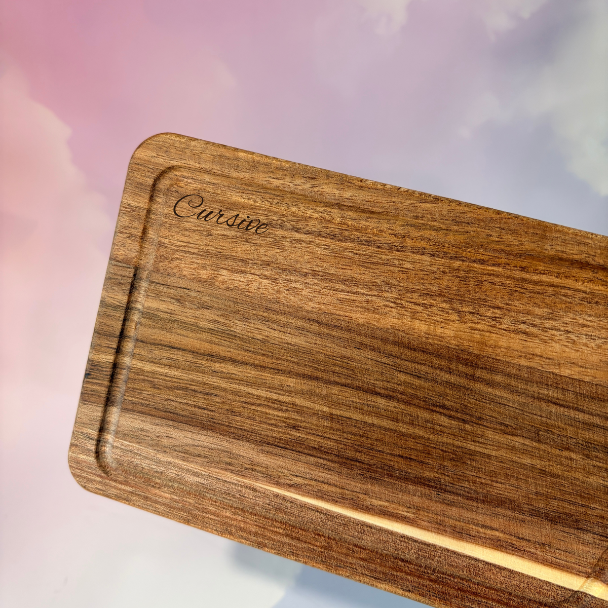 Personalized mini acacia wood charcuterie board with custom laser engraving, approximately 9.5 x 4.7 inches. Includes two serving tools, standard or cursive font options, and gift wrapping for a ready-to-give present.
