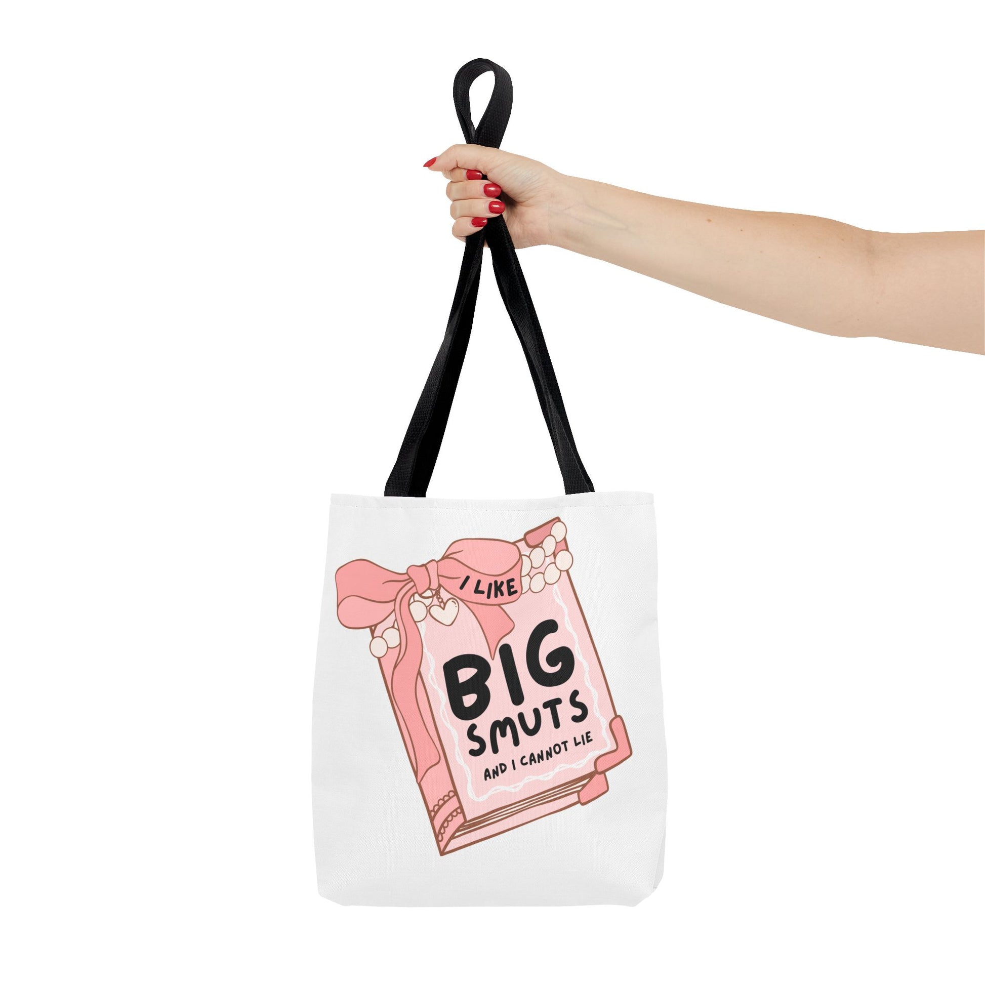 White tote bag with a pink book illustration and the phrase "I Like Big Smuts and I Cannot Lie." Perfect for romance readers, book lovers, and smut enthusiasts.