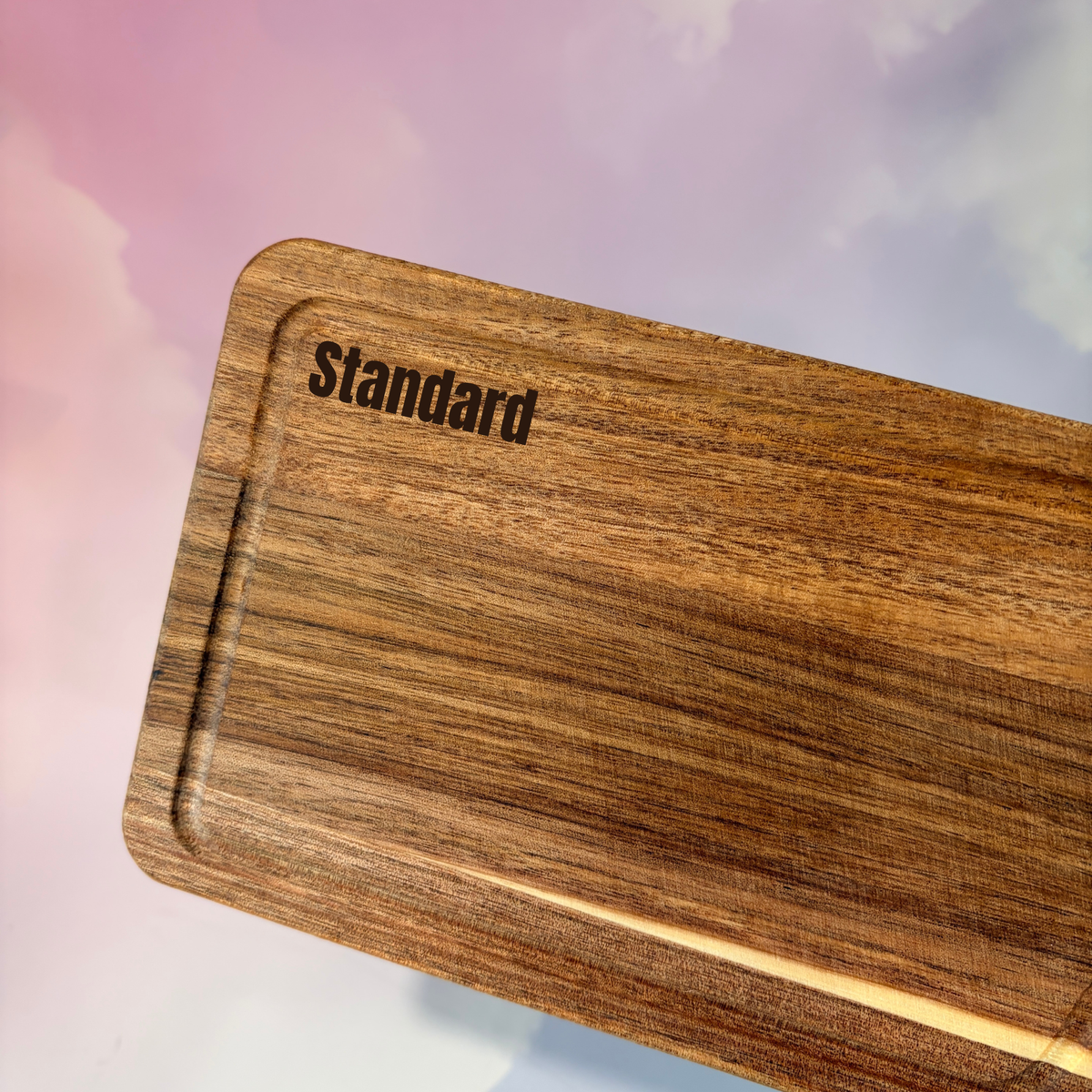 Personalized mini acacia wood charcuterie board with custom laser engraving, approximately 9.5 x 4.7 inches. Includes two serving tools, standard or cursive font options, and gift wrapping for a ready-to-give present.
