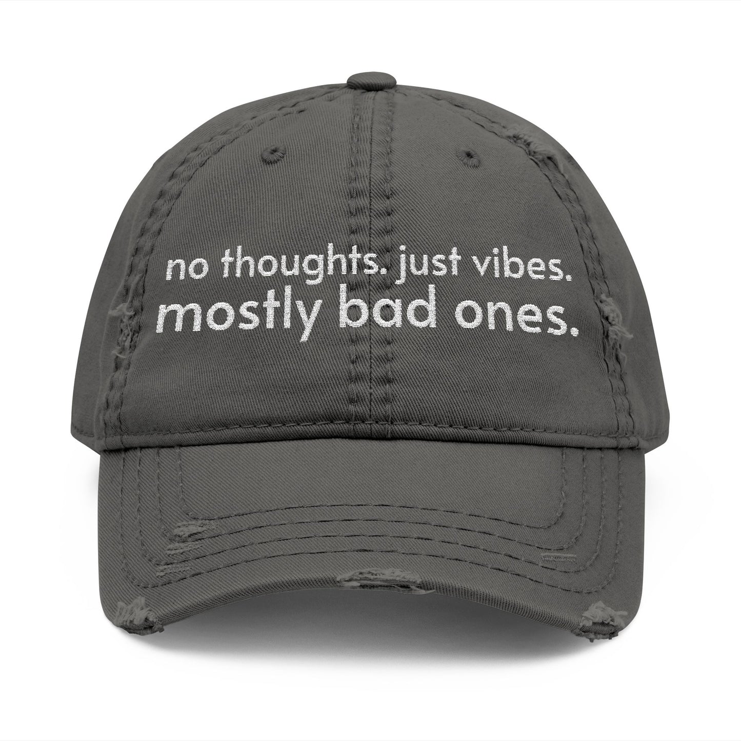 Distressed ball cap embroidered with “no thoughts just vibes mostly bad ones”.
