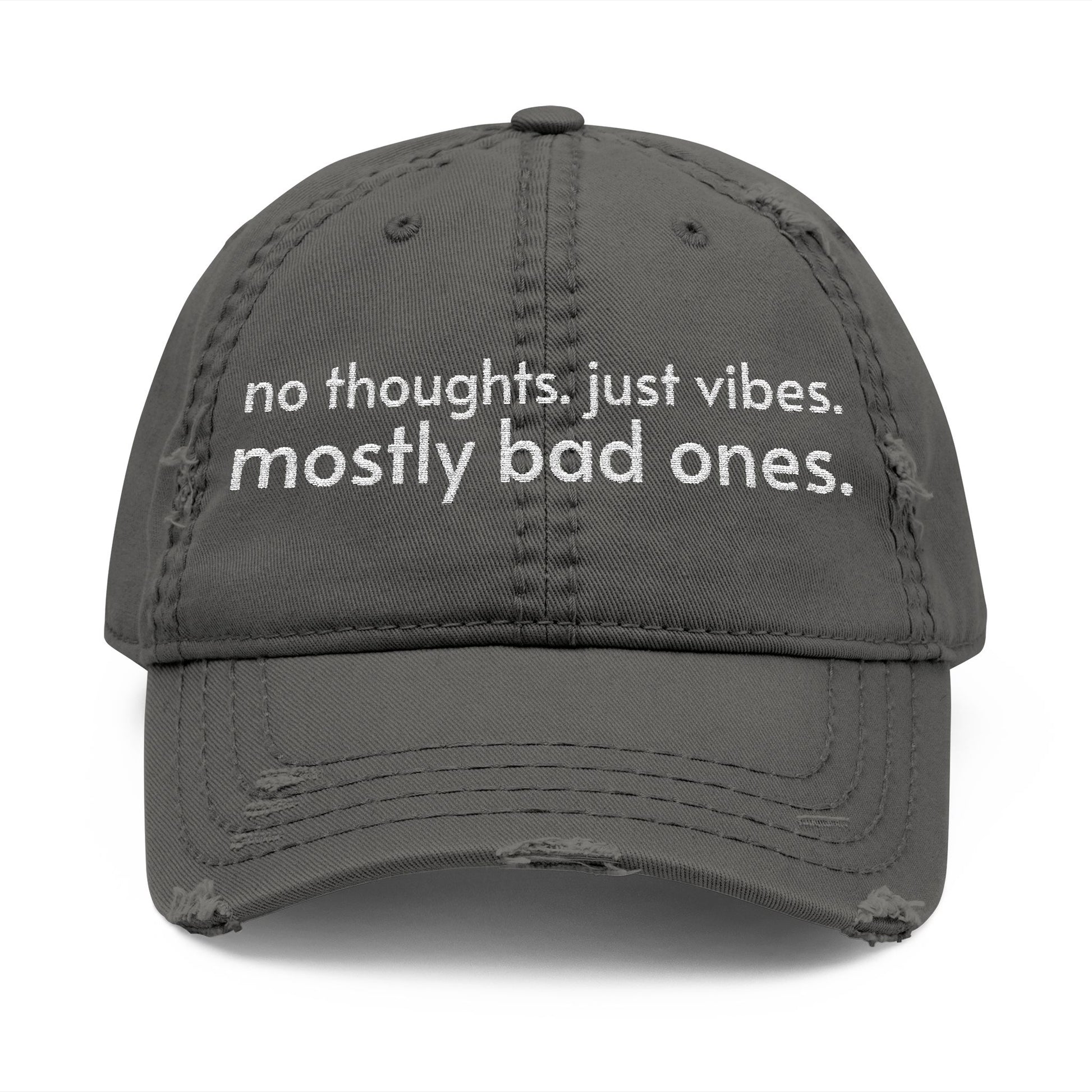 Distressed ball cap embroidered with “no thoughts just vibes mostly bad ones”.