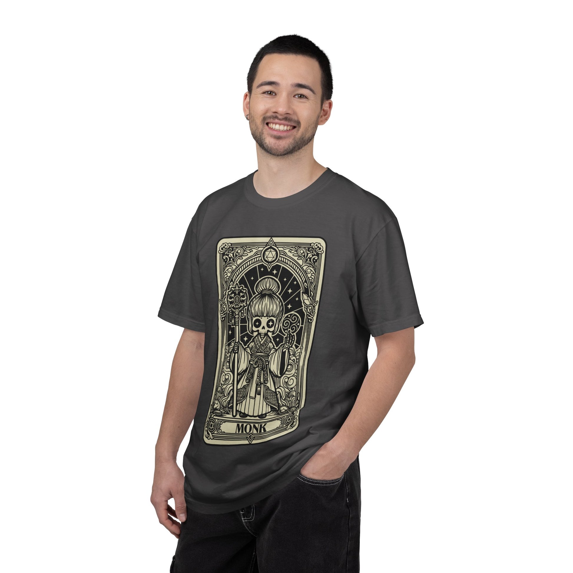 Man wearing a dark gray t-shirt with a graphic Monk design on a white background