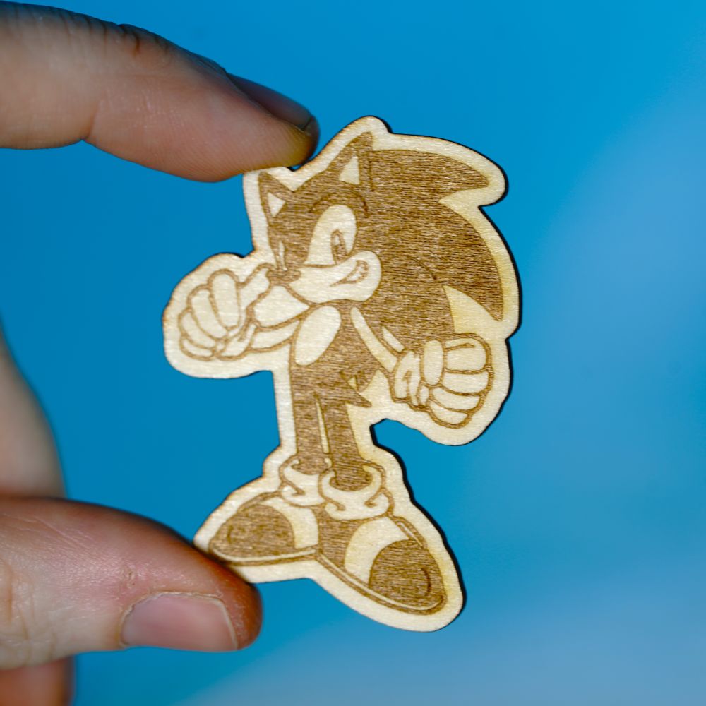 Laser engraved wooden pin featuring Sonic the Hedgehog, perfect for retro gaming fans, handmade geek gifts, or collectors of nostalgic video game merch.