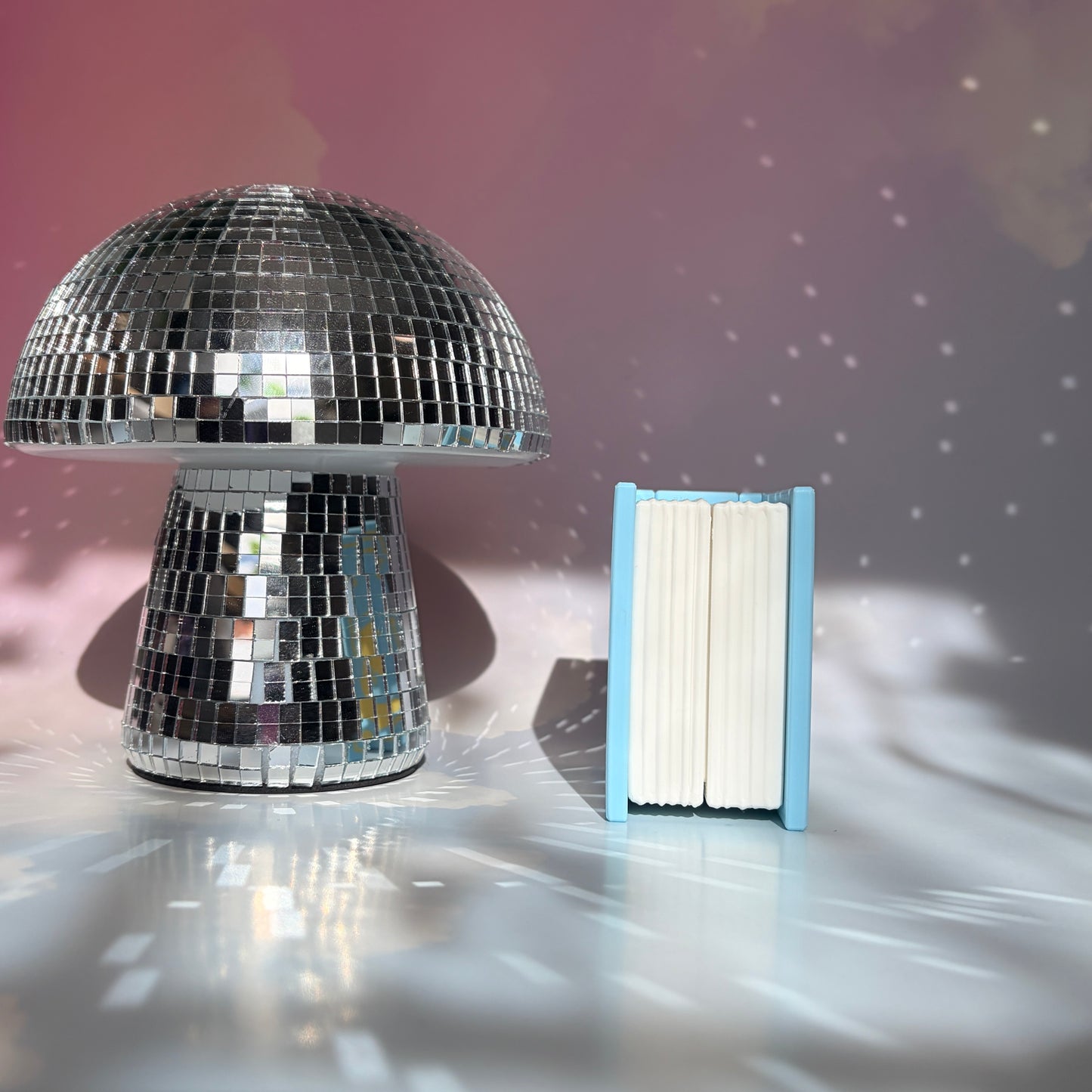 Book-shaped fidget clicker opening to a box of chocolates