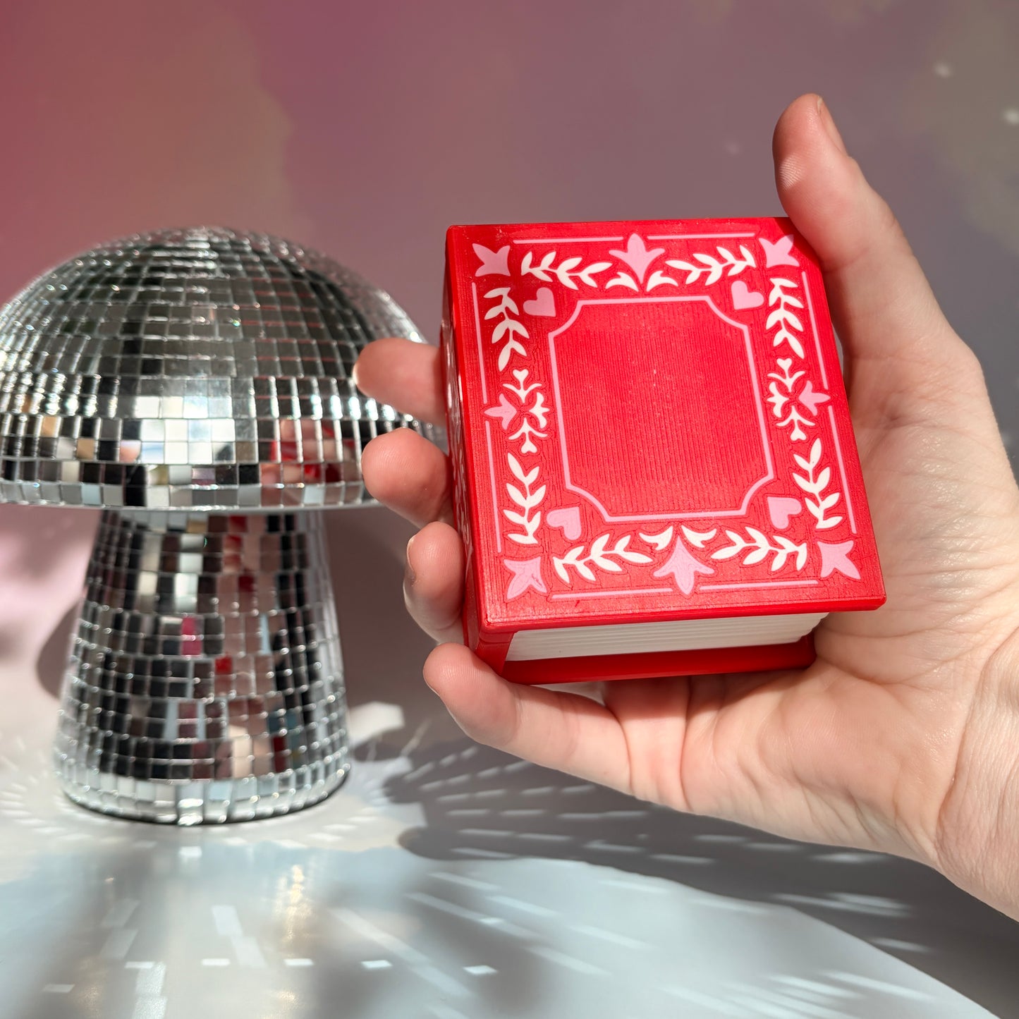 Valentine themed book fidget clicker with chocolate box interior.
