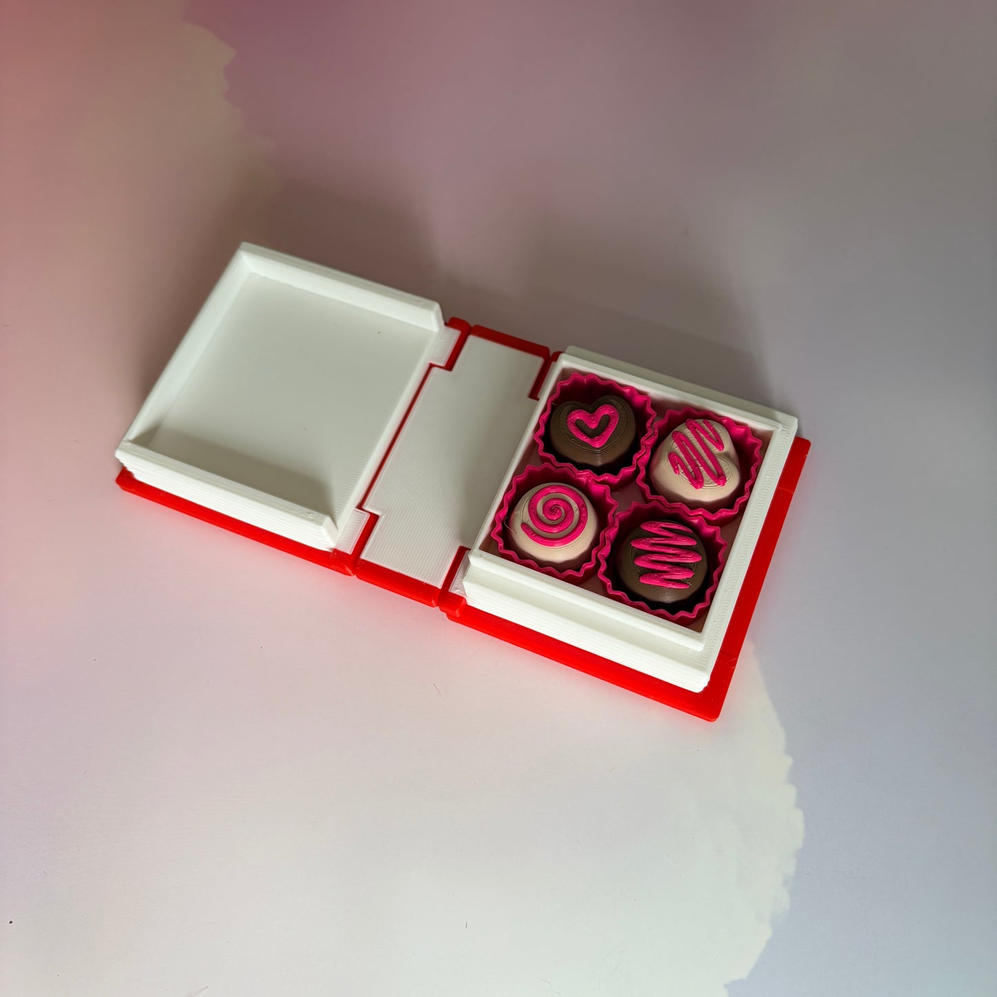 Valentine themed book fidget clicker with chocolate box interior.