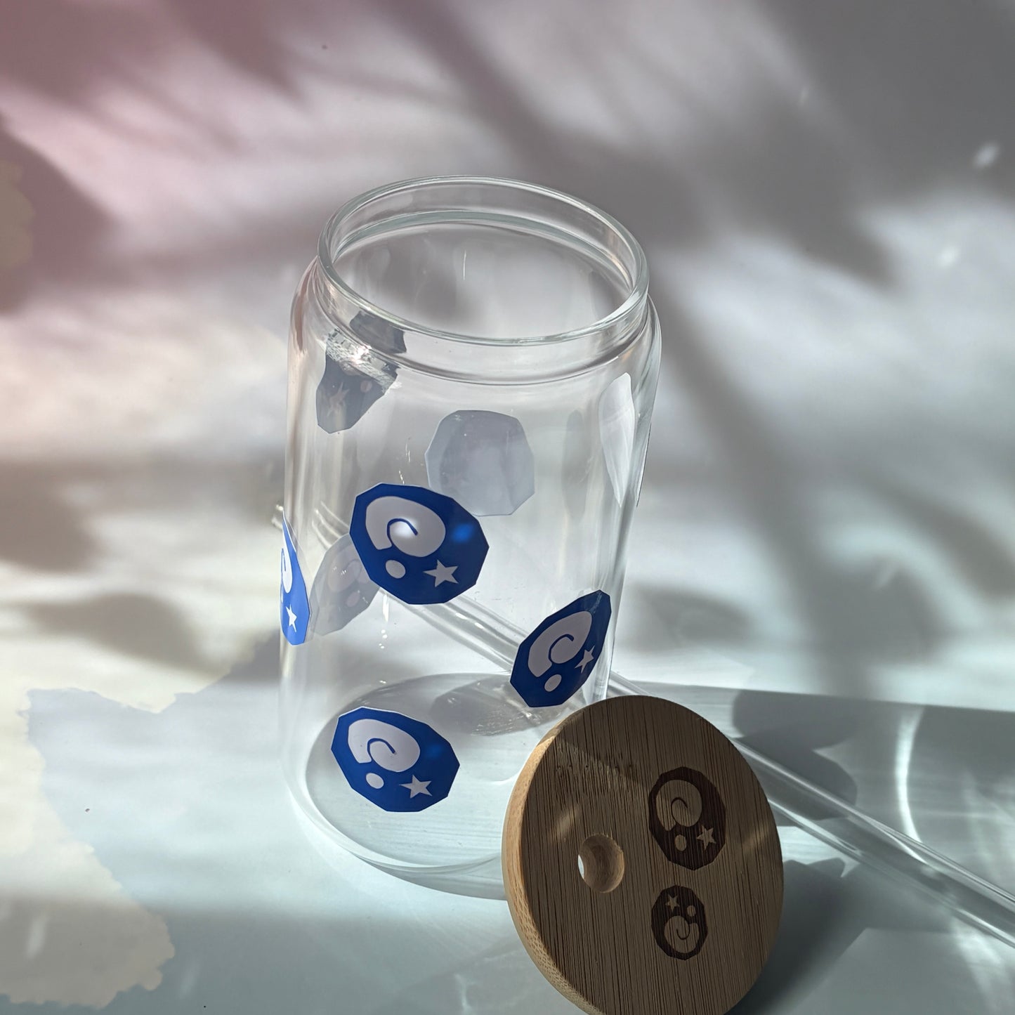 Glass tumbler with bamboo lid featuring Animal Crossing inspired fossil designs.