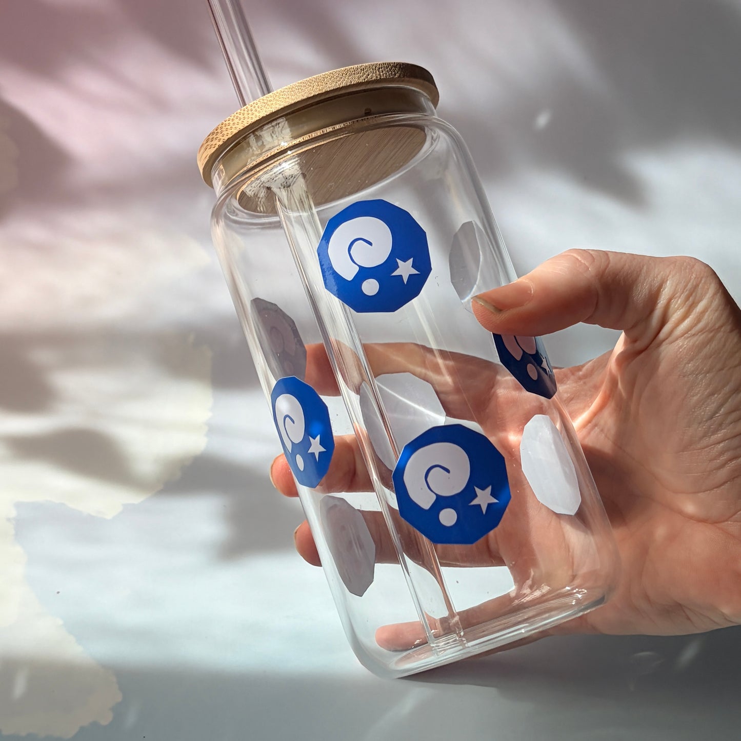 Glass tumbler with bamboo lid featuring Animal Crossing inspired fossil designs.