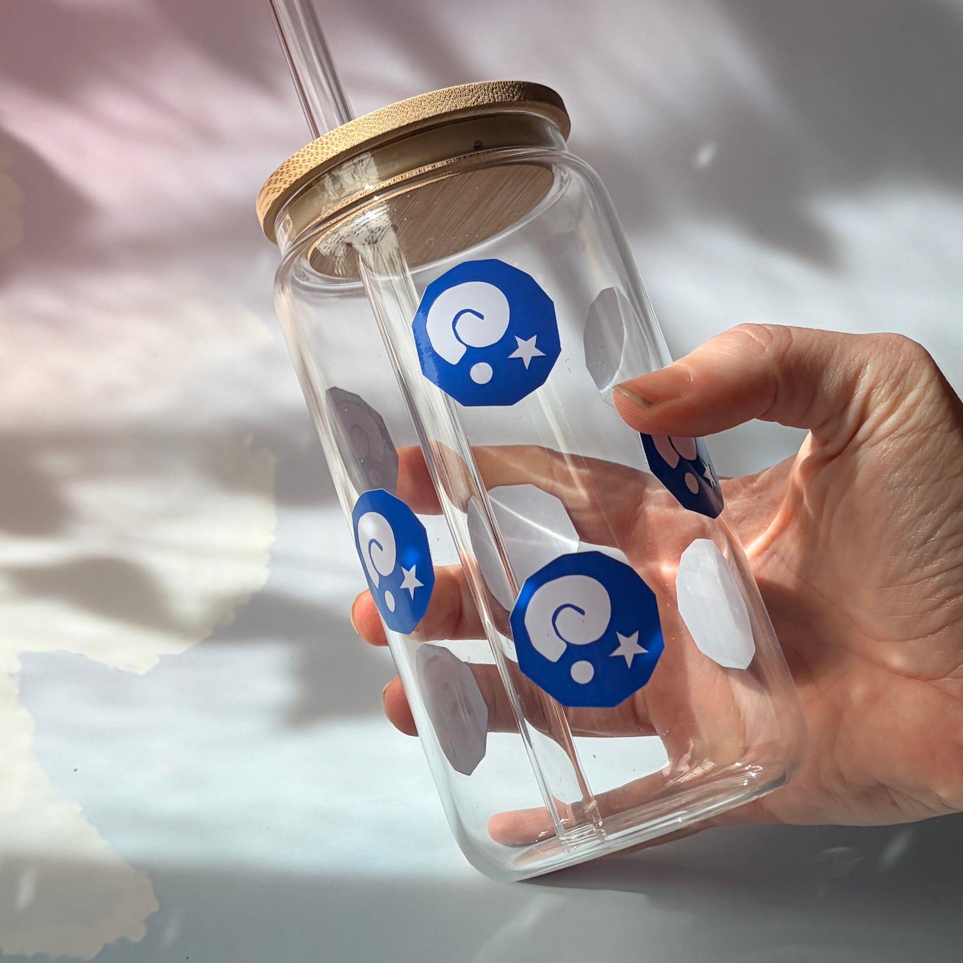 Glass tumbler with bamboo lid featuring Animal Crossing inspired fossil designs.