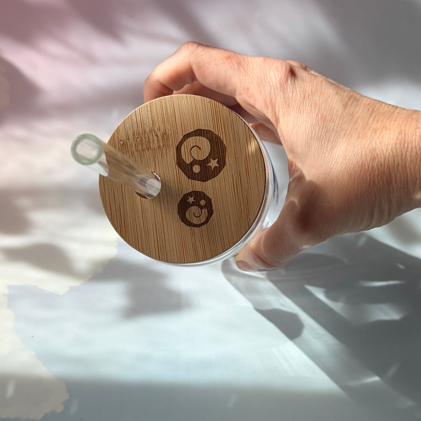 Glass tumbler with bamboo lid featuring Animal Crossing inspired fossil designs.