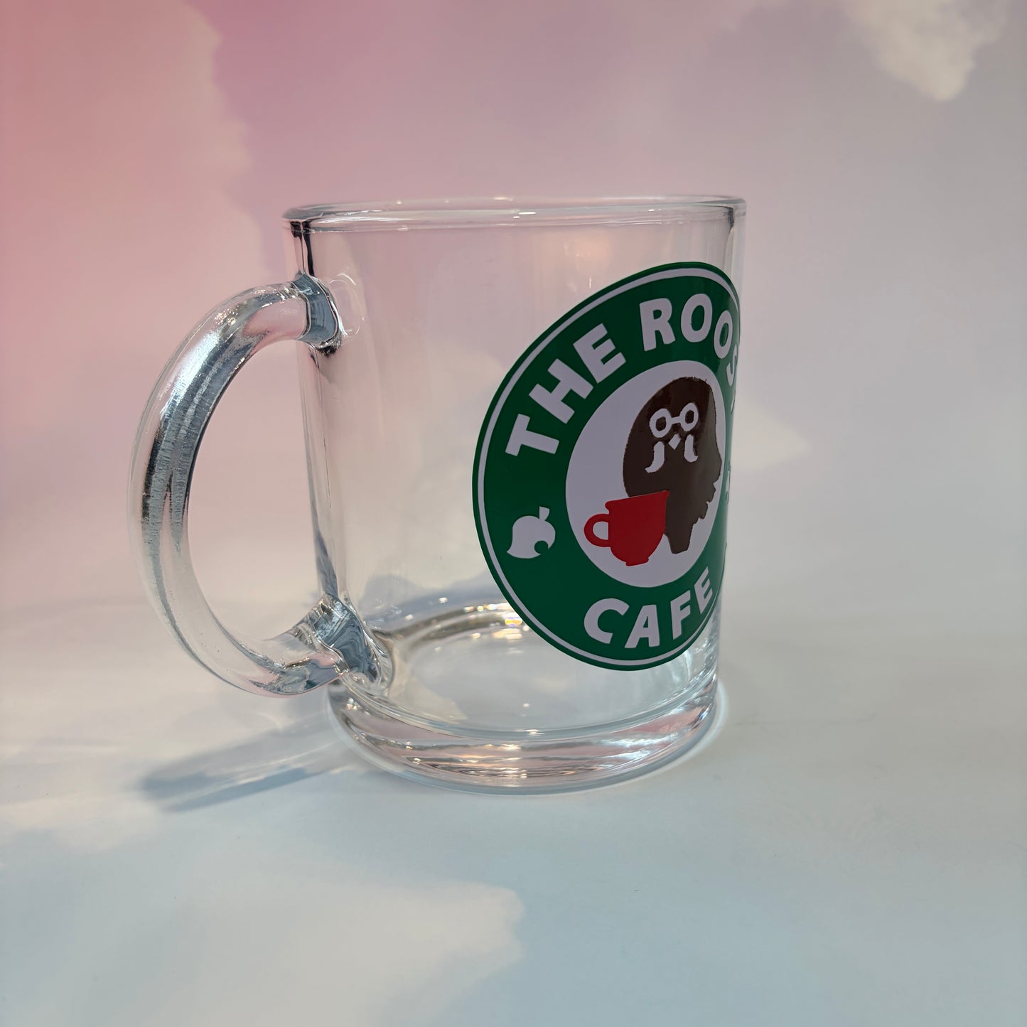 Glass coffee cup with Roost Café inspired vinyl logo.