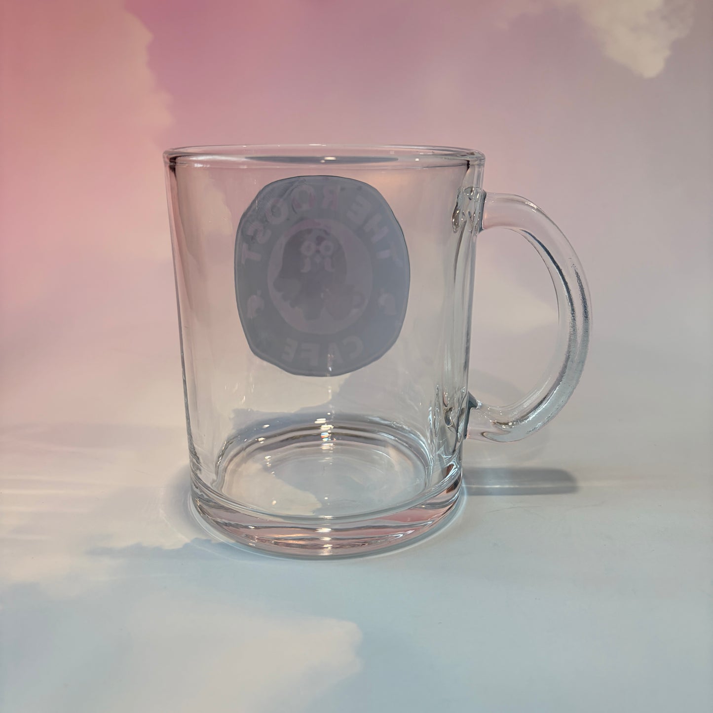 Glass coffee cup with Roost Café inspired vinyl logo.