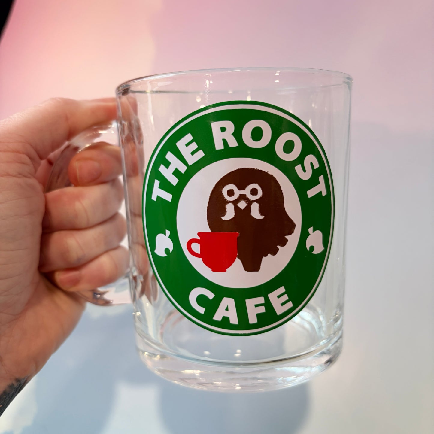 Glass coffee cup with Roost Café inspired vinyl logo.