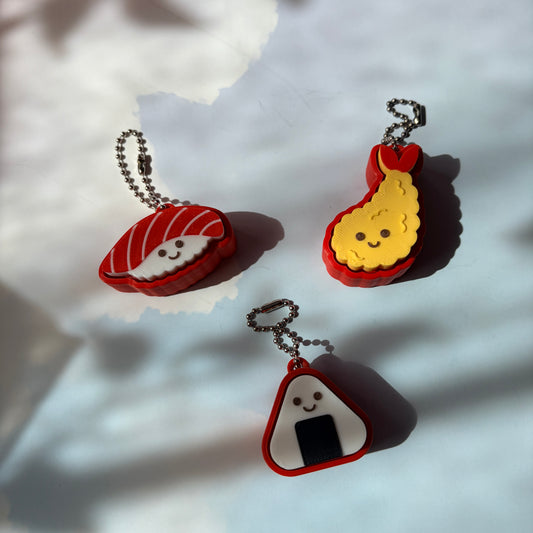 Sushi shaped 3D printed fidget clicker keychain. 