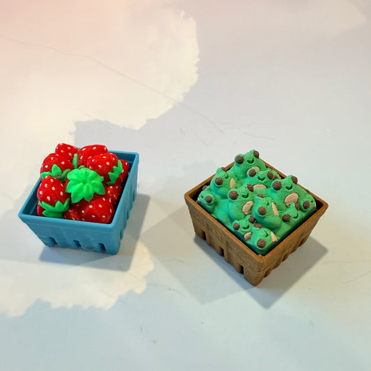 Farmers market themed fidget clicker featuring strawberries and frogs.