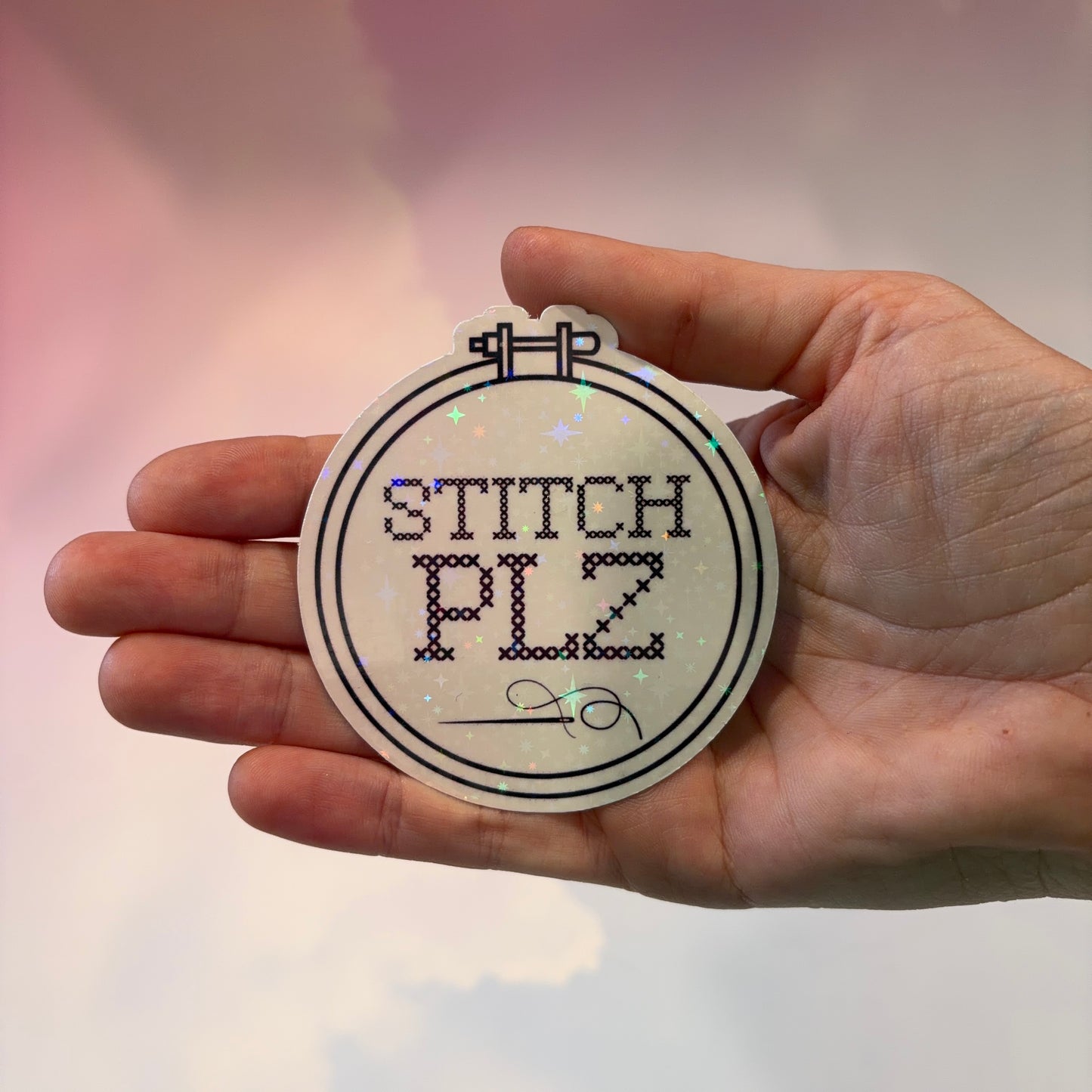 Black and white holographic vinyl sticker featuring a cross stitch hoop with the phrase "STITCH, PLZ," weather and water resistant.