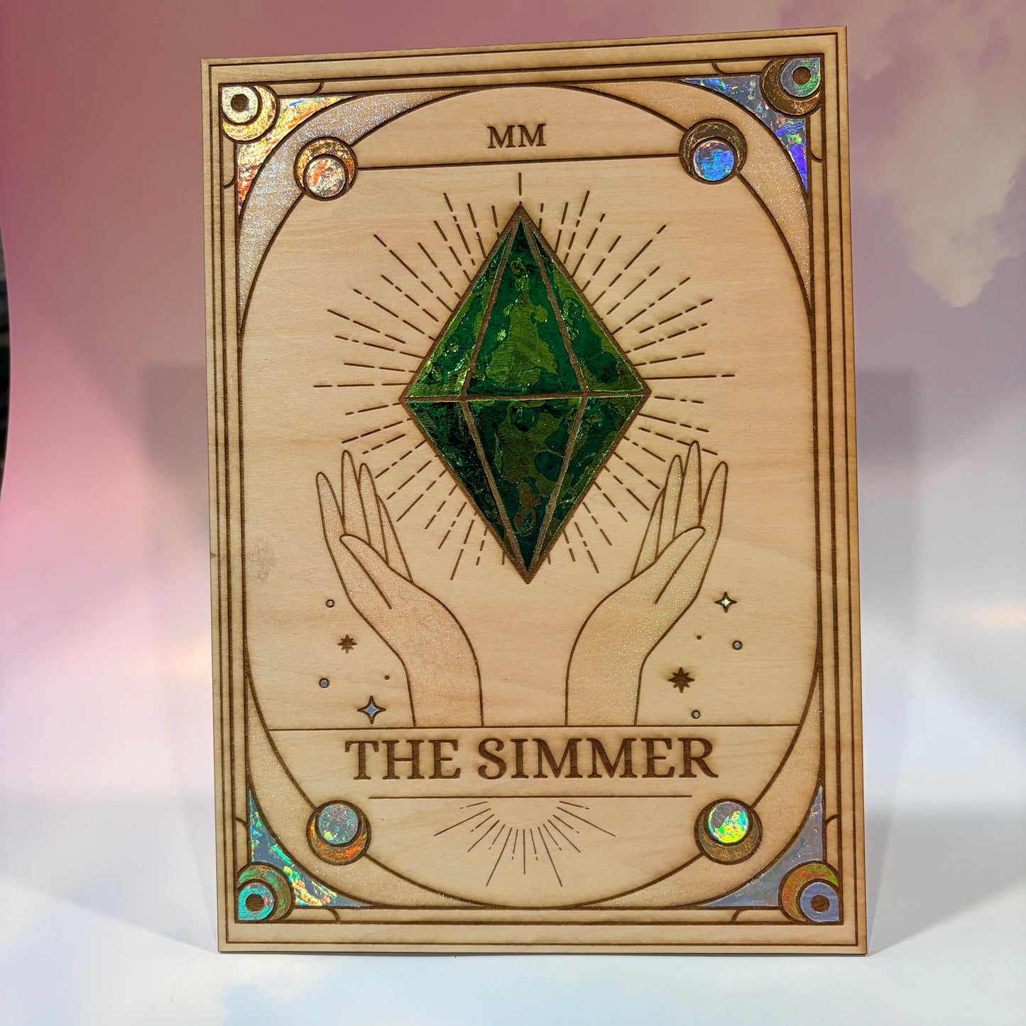 Large laser engraved wooden tarot card featuring a colorful Sims-inspired plumbob with holographic gold and silver foil accents.