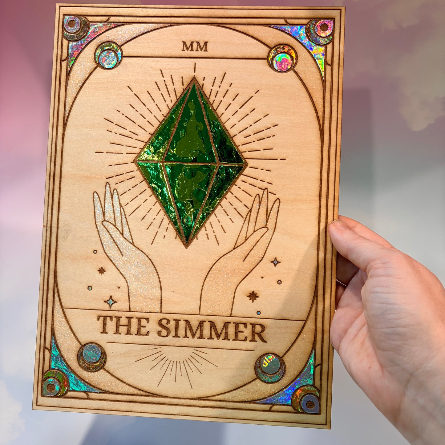 Large laser engraved wooden tarot card featuring a colorful Sims-inspired plumbob with holographic gold and silver foil accents.