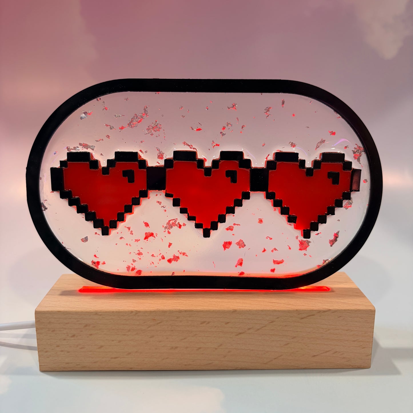 Handmade LED pixel heart container light with a hand-poured resin panel, silver leaf accents, laser-cut acrylic hearts, and customizable RGB lighting.