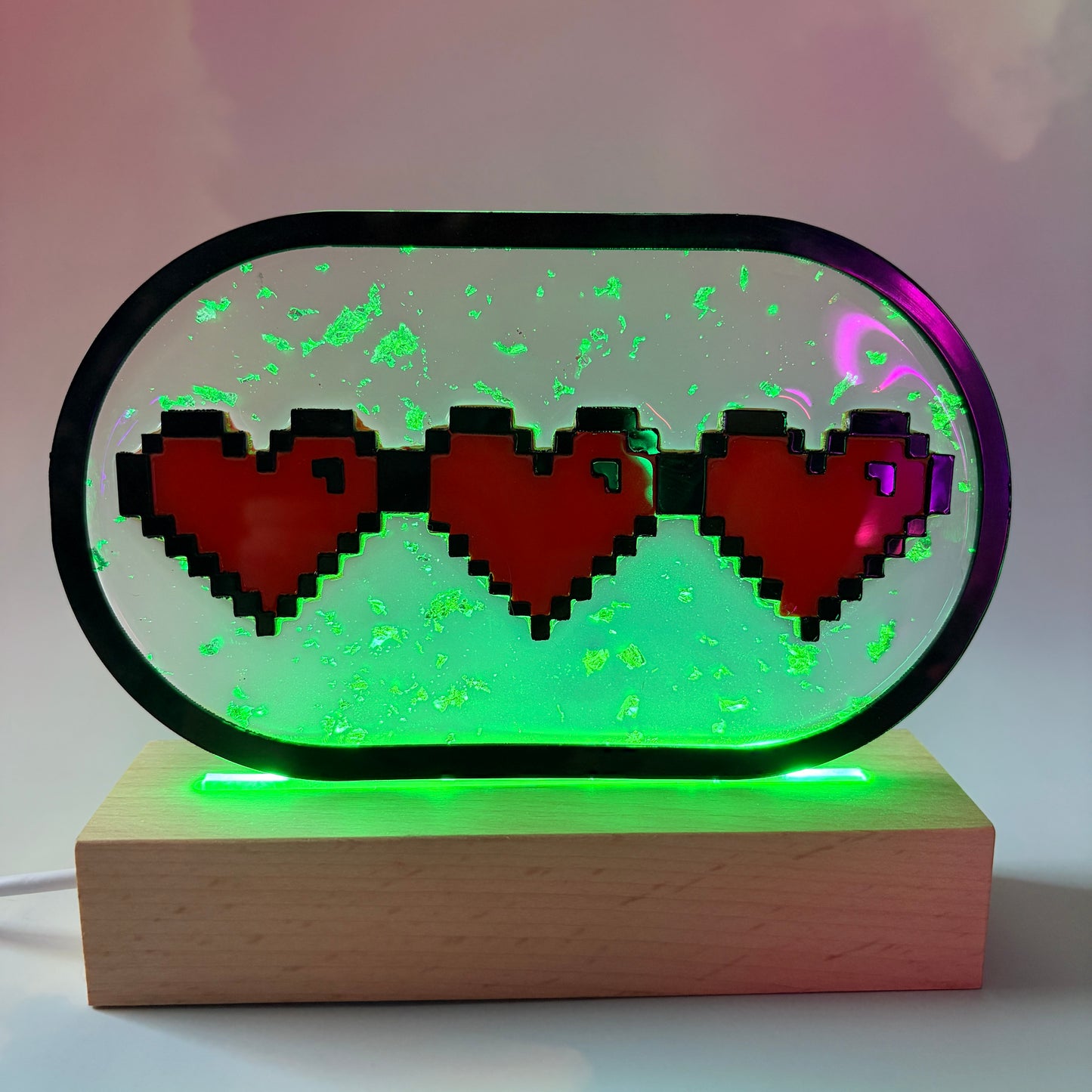 Handmade LED pixel heart container light with a hand-poured resin panel, silver leaf accents, laser-cut acrylic hearts, and customizable RGB lighting.