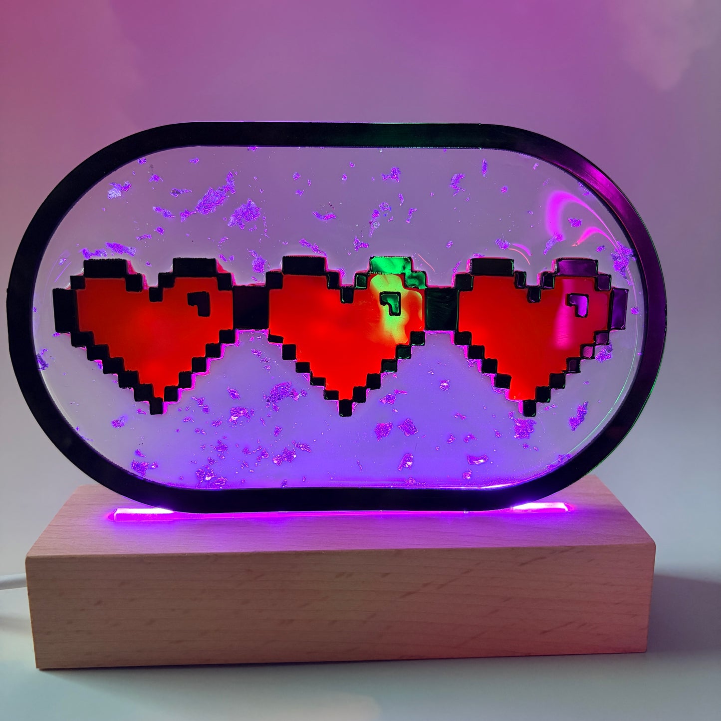 Handmade LED pixel heart container light with a hand-poured resin panel, silver leaf accents, laser-cut acrylic hearts, and customizable RGB lighting.