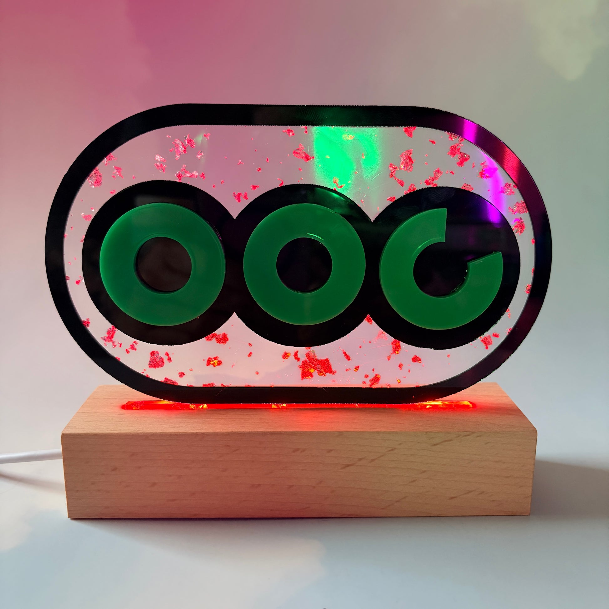 Handmade stamina wheel LED lamp with a hand-poured resin panel, silver leaf accents, laser-cut green acrylic design, and customizable RGB lighting.