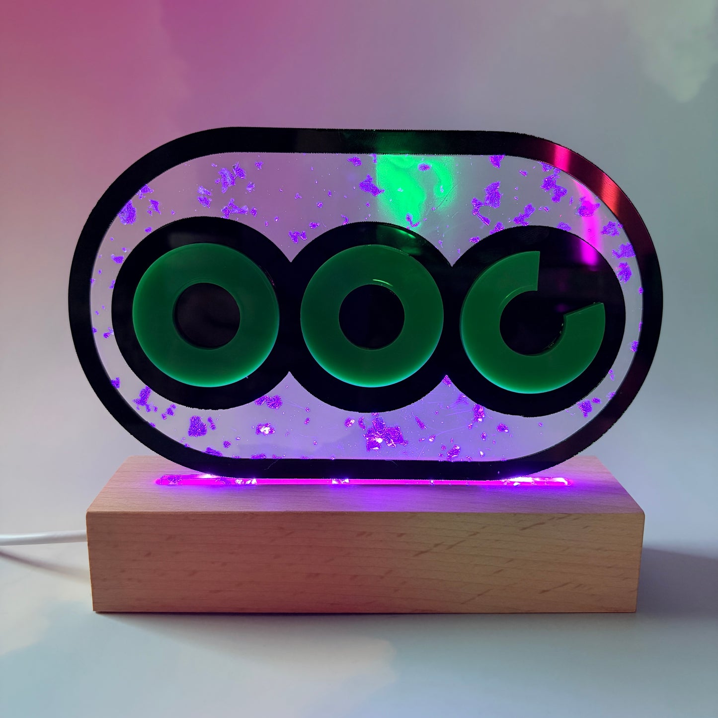 Handmade stamina wheel LED lamp with a hand-poured resin panel, silver leaf accents, laser-cut green acrylic design, and customizable RGB lighting.