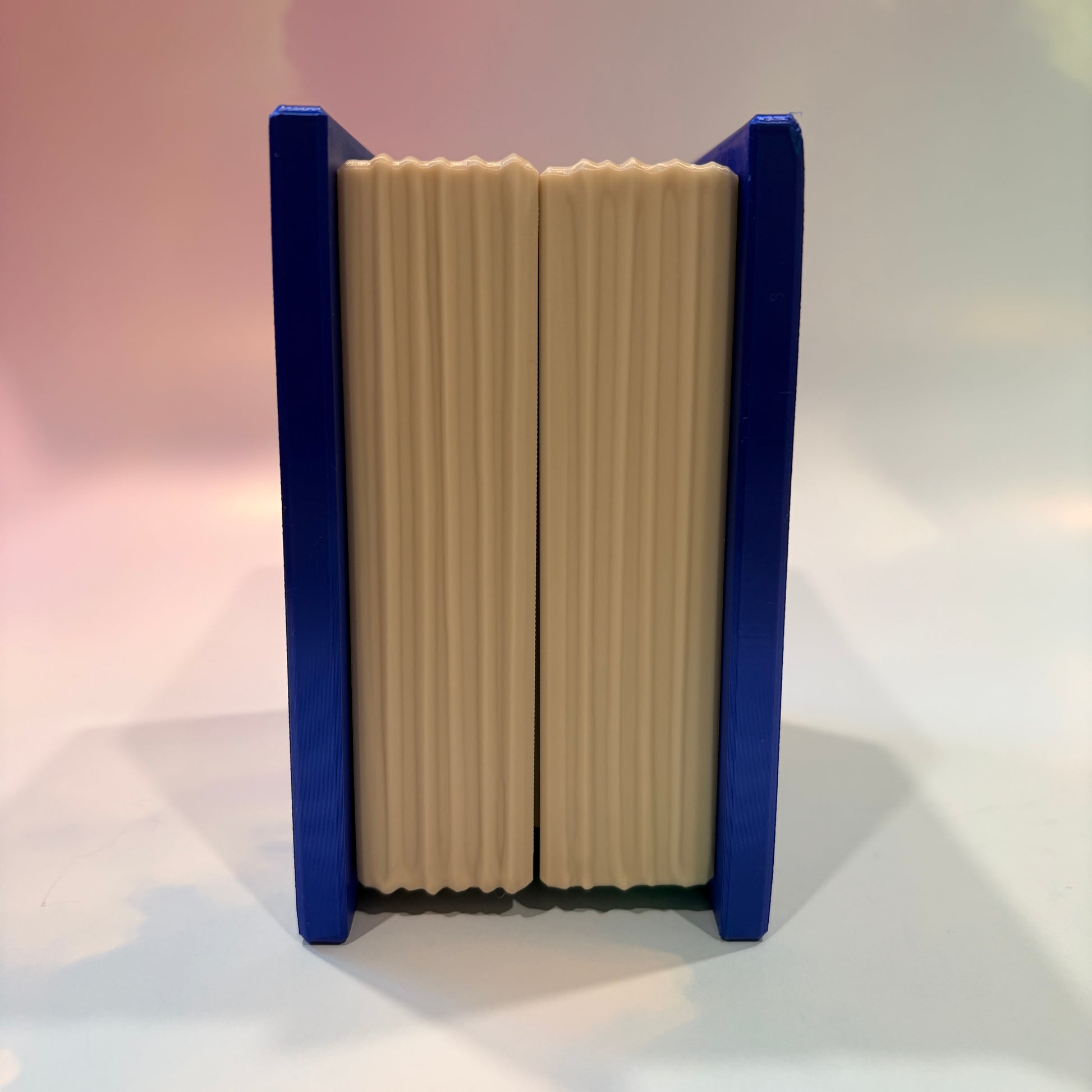 Royal blue and metallic gold 3D printed book box with a celestial moon and stars design on the cover. Opens to reveal a hidden storage compartment that holds 1–2 sets of RPG dice and doubles as a rolling tray. Perfect for jewelry, trinkets, and tabletop gaming accessories.