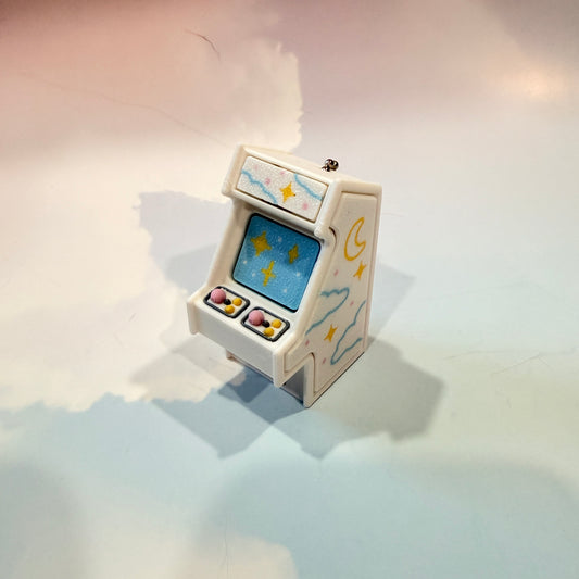 Mini retro arcade machine fidget clicker keychain with pastel color way, blue screen, and 3D printed design, available in clicky or silent.