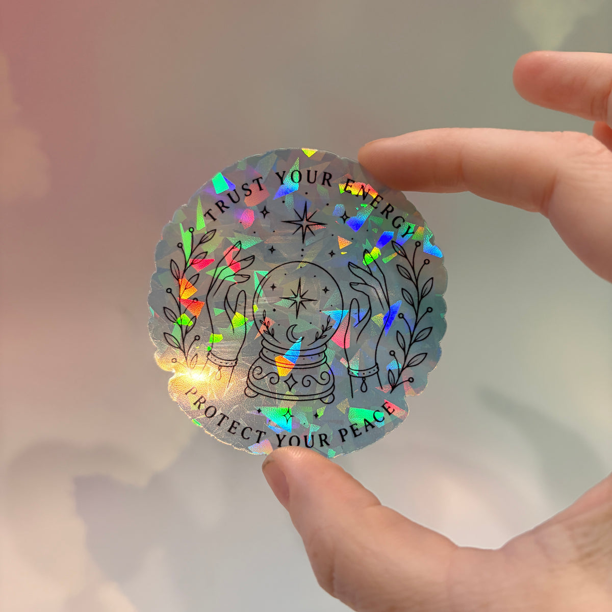 Holographic neurodivergent witchy sticker made from water-resistant vinyl, approximately 2.75 inches, featuring magical designs and neurodivergent humor.