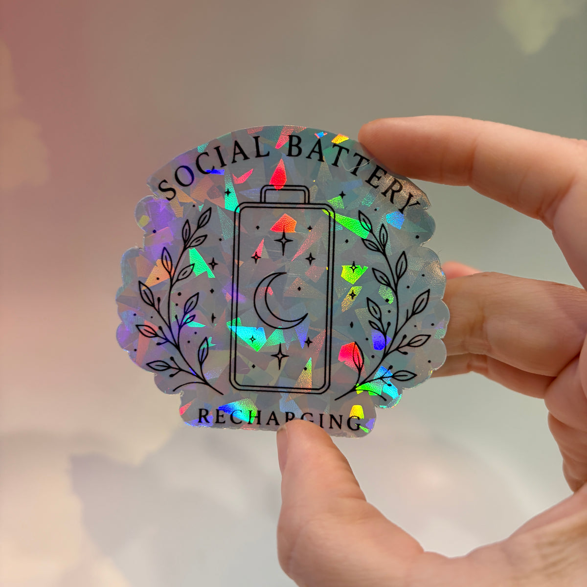 Holographic neurodivergent witchy sticker made from water-resistant vinyl, approximately 2.75 inches, featuring magical designs and neurodivergent humor.