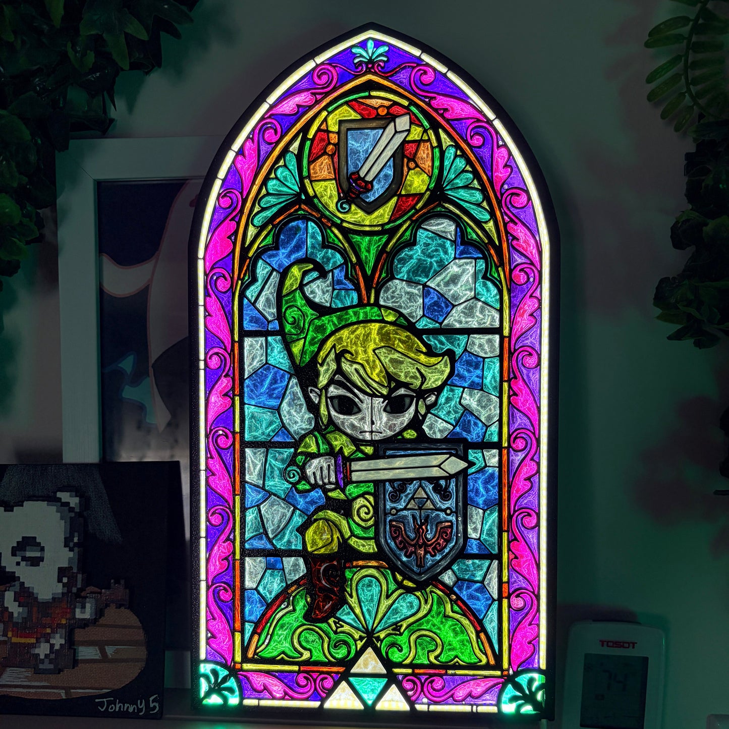 Handmade Zelda-inspired stained glass window light featuring hand-tinted resin artwork in a 3D printed frame with glowing interior LED lighting.