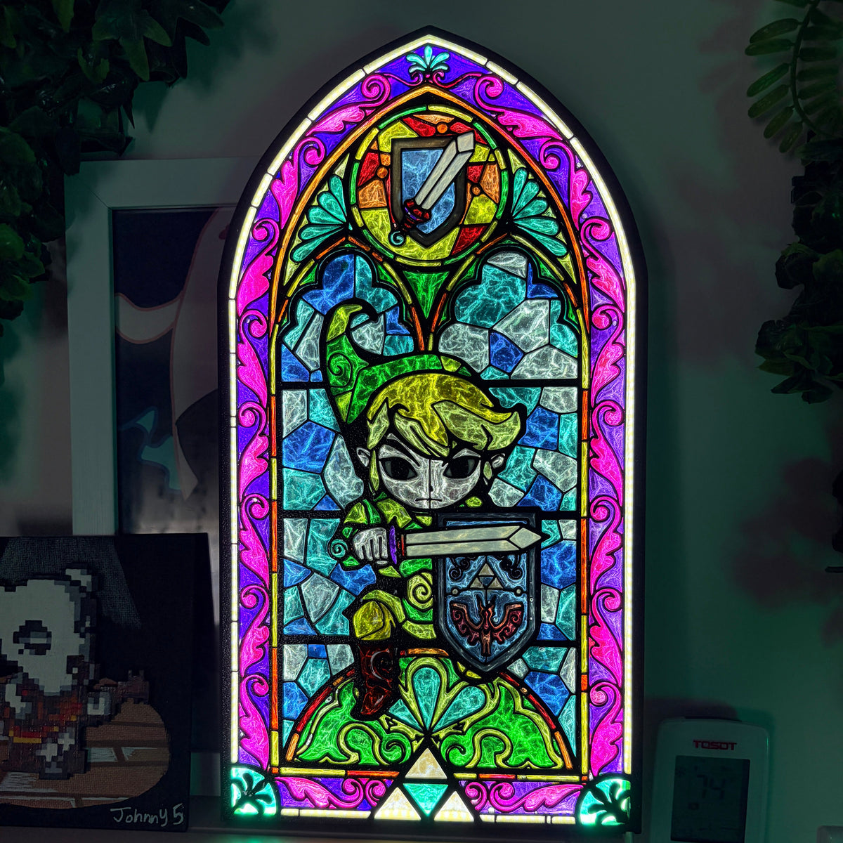 Handmade Zelda-inspired stained glass window light featuring hand-tinted resin artwork in a 3D printed frame with glowing interior LED lighting.