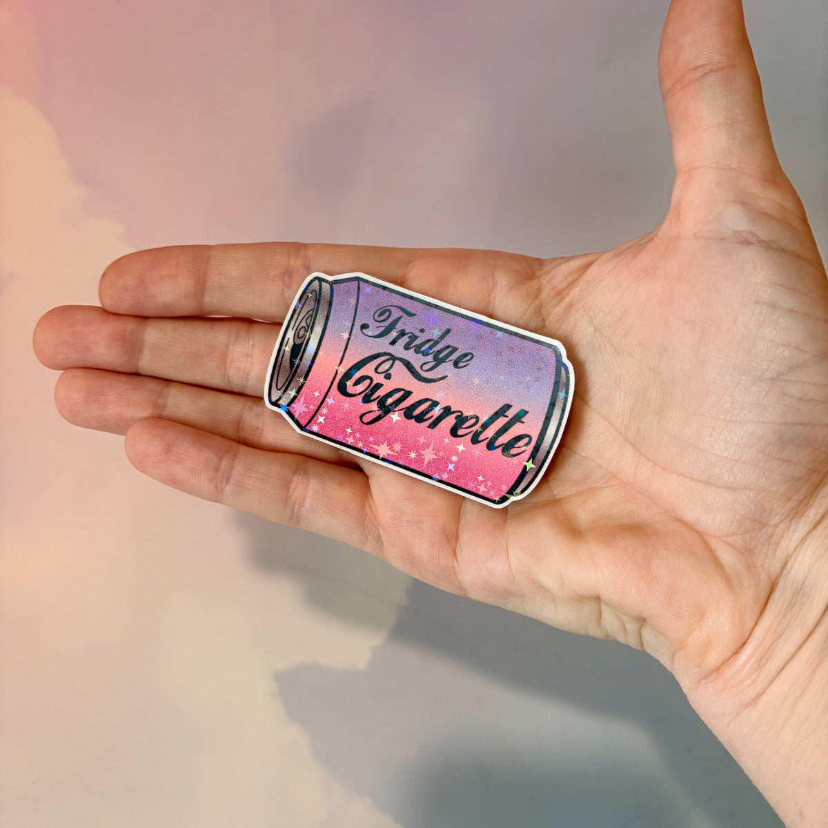 Holographic water-resistant vinyl sticker featuring a soda can with the phrase “Fridge Cigarette” in bold lettering.