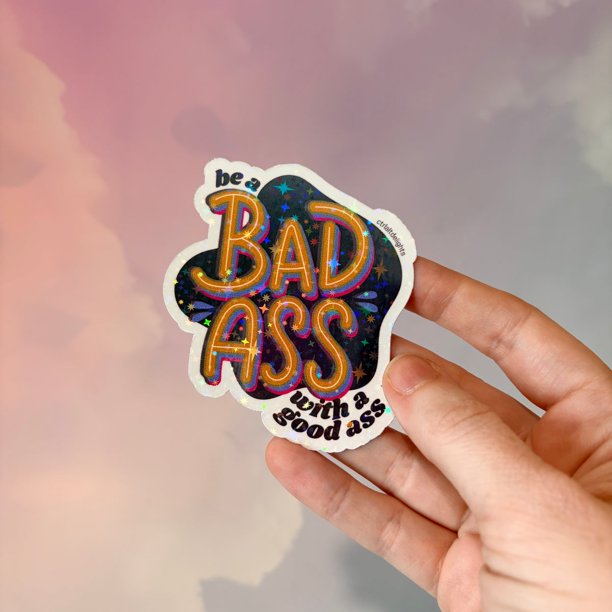 This vibrant vinyl sticker with the phrase 'Be a Badass with a Good Ass' is perfect for adding motivational flair to your laptop, water bottle, or journal. The playful yet bold design is sure to inspire confidence wherever you place it.