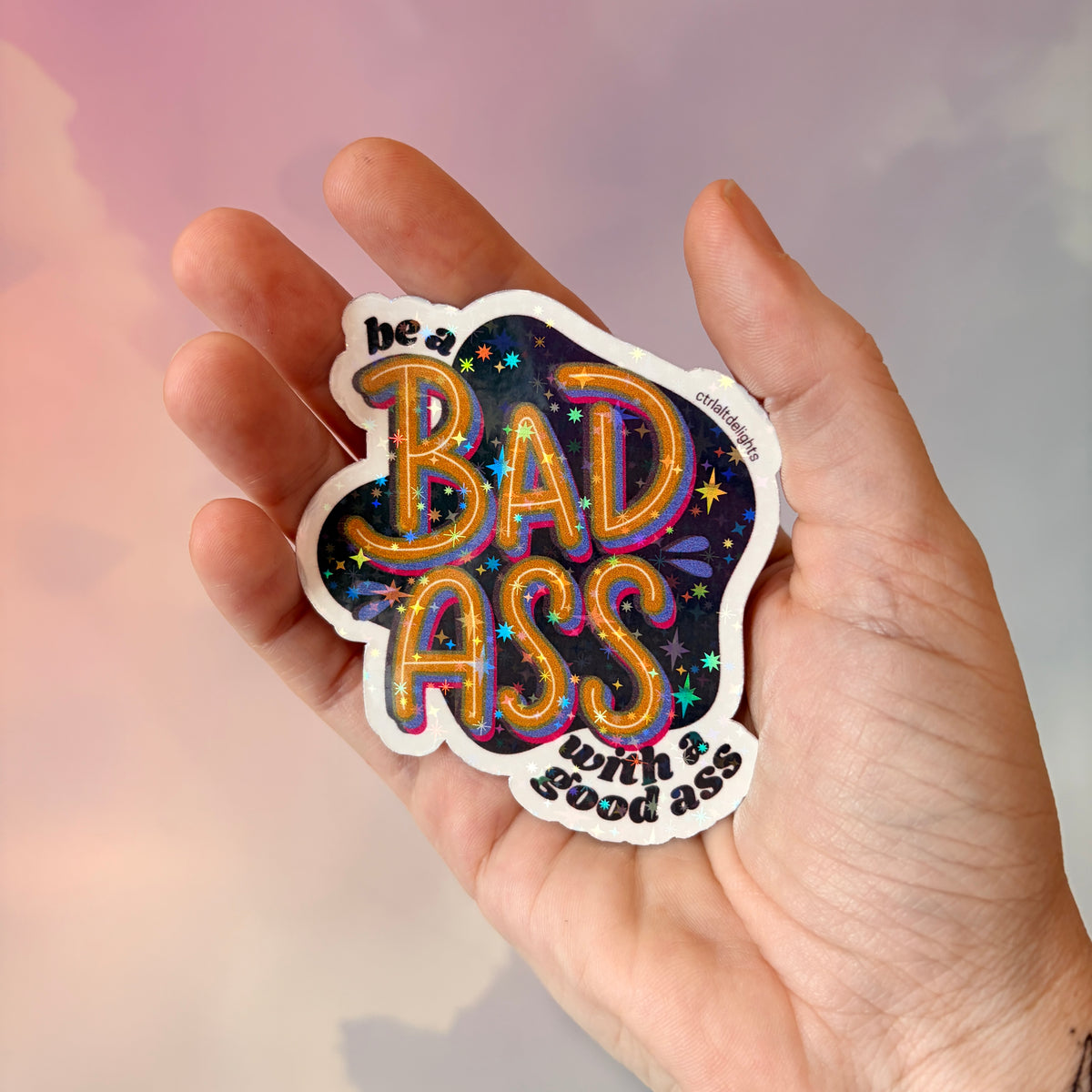 This vibrant vinyl sticker with the phrase 'Be a Badass with a Good Ass' is perfect for adding motivational flair to your laptop, water bottle, or journal. The playful yet bold design is sure to inspire confidence wherever you place it.