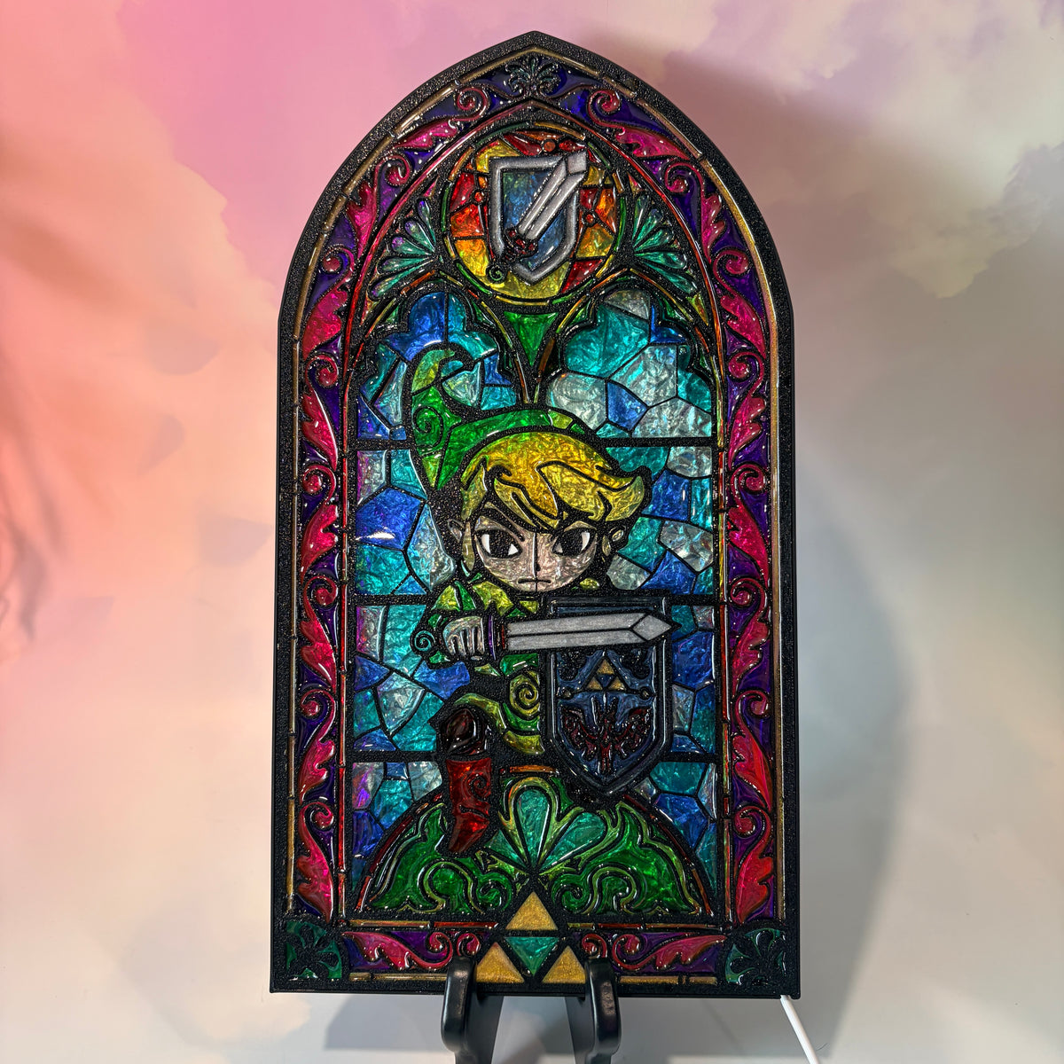 Handmade Zelda-inspired stained glass window light featuring hand-tinted resin artwork in a 3D printed frame with glowing interior LED lighting.