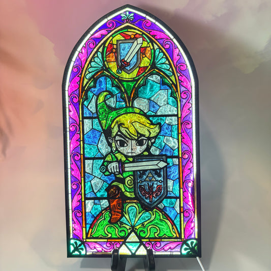 Handmade Zelda-inspired stained glass window light featuring hand-tinted resin artwork in a 3D printed frame with glowing interior LED lighting.