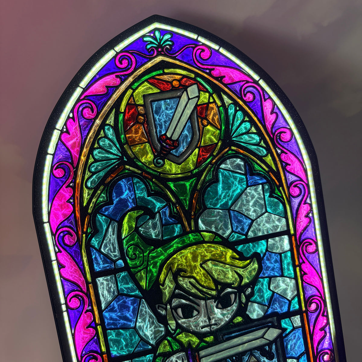Handmade Zelda-inspired stained glass window light featuring hand-tinted resin artwork in a 3D printed frame with glowing interior LED lighting.