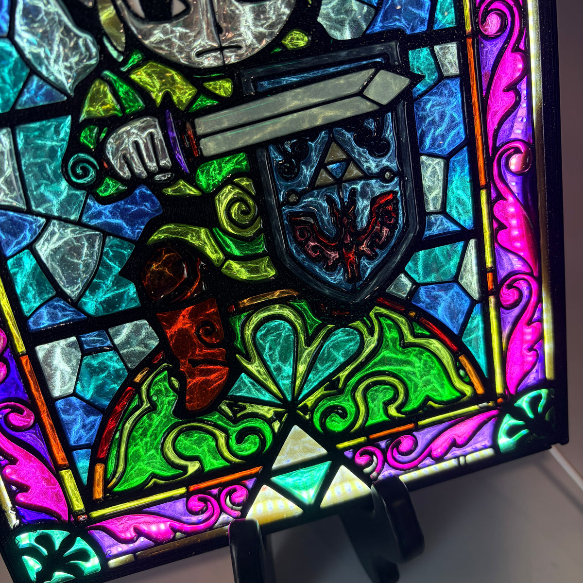 Handmade Zelda-inspired stained glass window light featuring hand-tinted resin artwork in a 3D printed frame with glowing interior LED lighting.