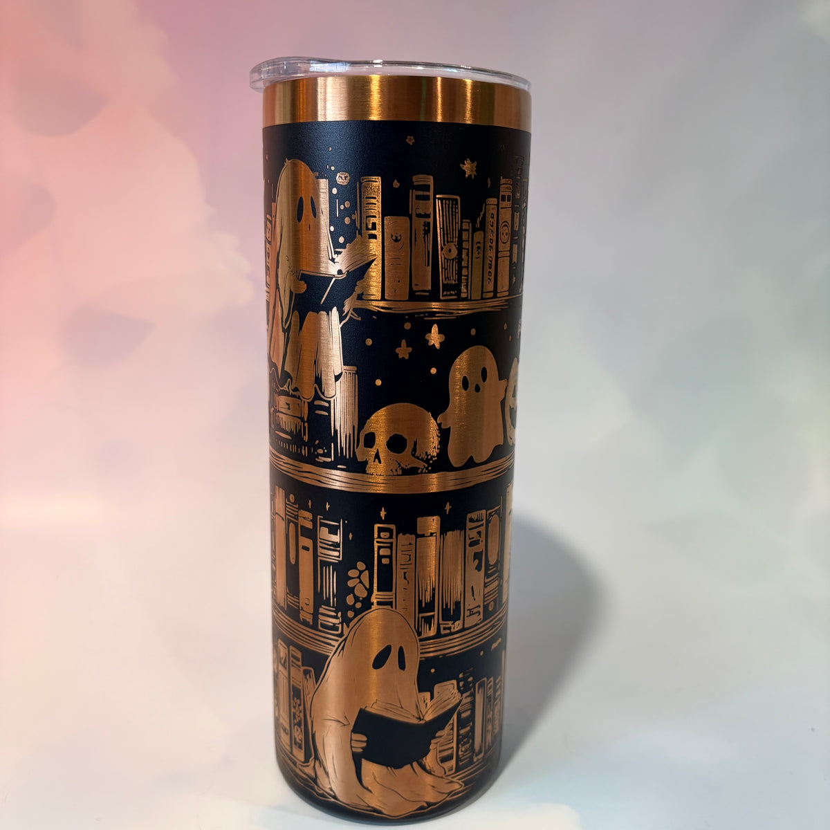 20oz laser engraved skinny tumbler featuring Halloween books, ghosts, bats, and spiderwebs. Perfect spooky drinkware for witchy book lovers and gothic décor fans.