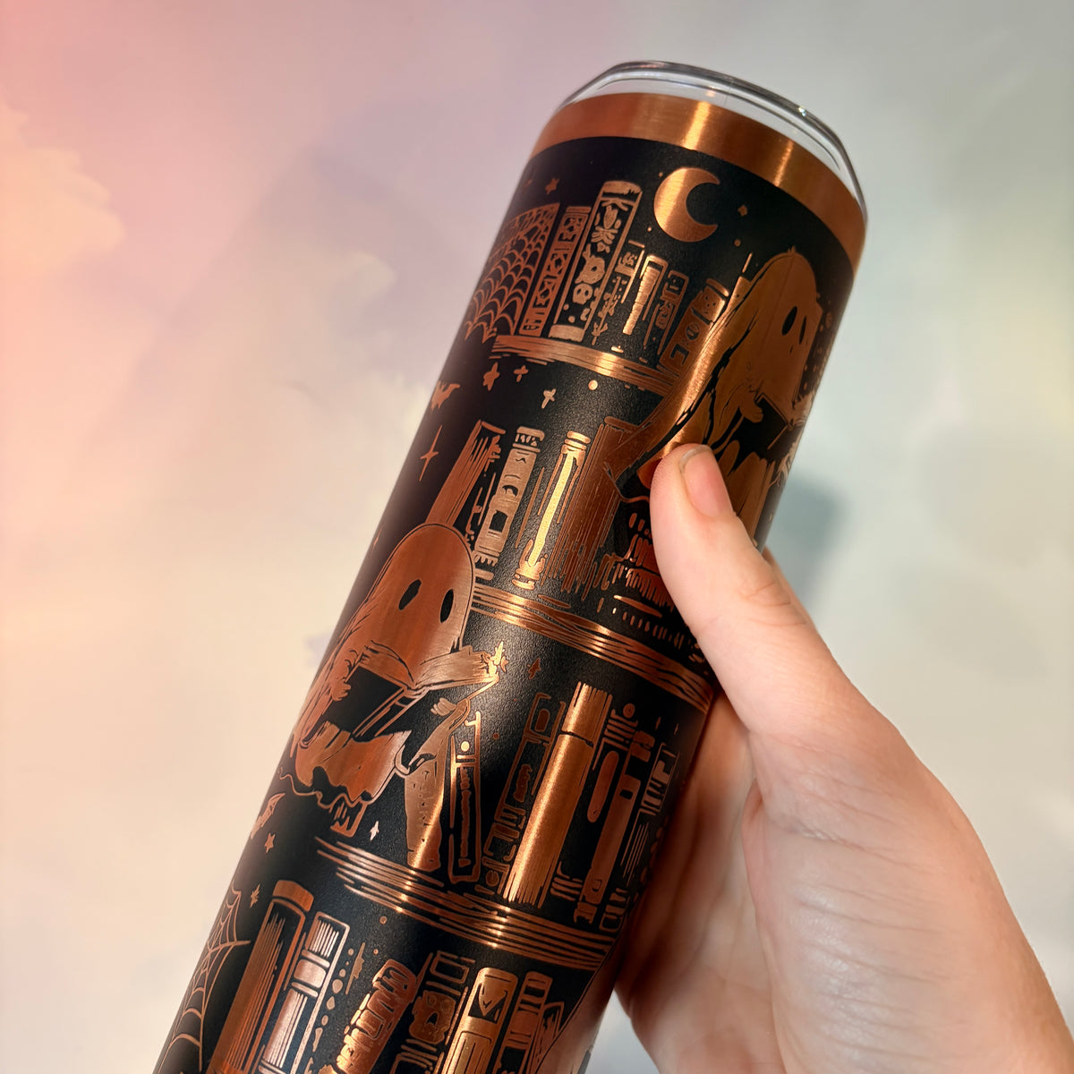 20oz laser engraved skinny tumbler featuring Halloween books, ghosts, bats, and spiderwebs. Perfect spooky drinkware for witchy book lovers and gothic décor fans.