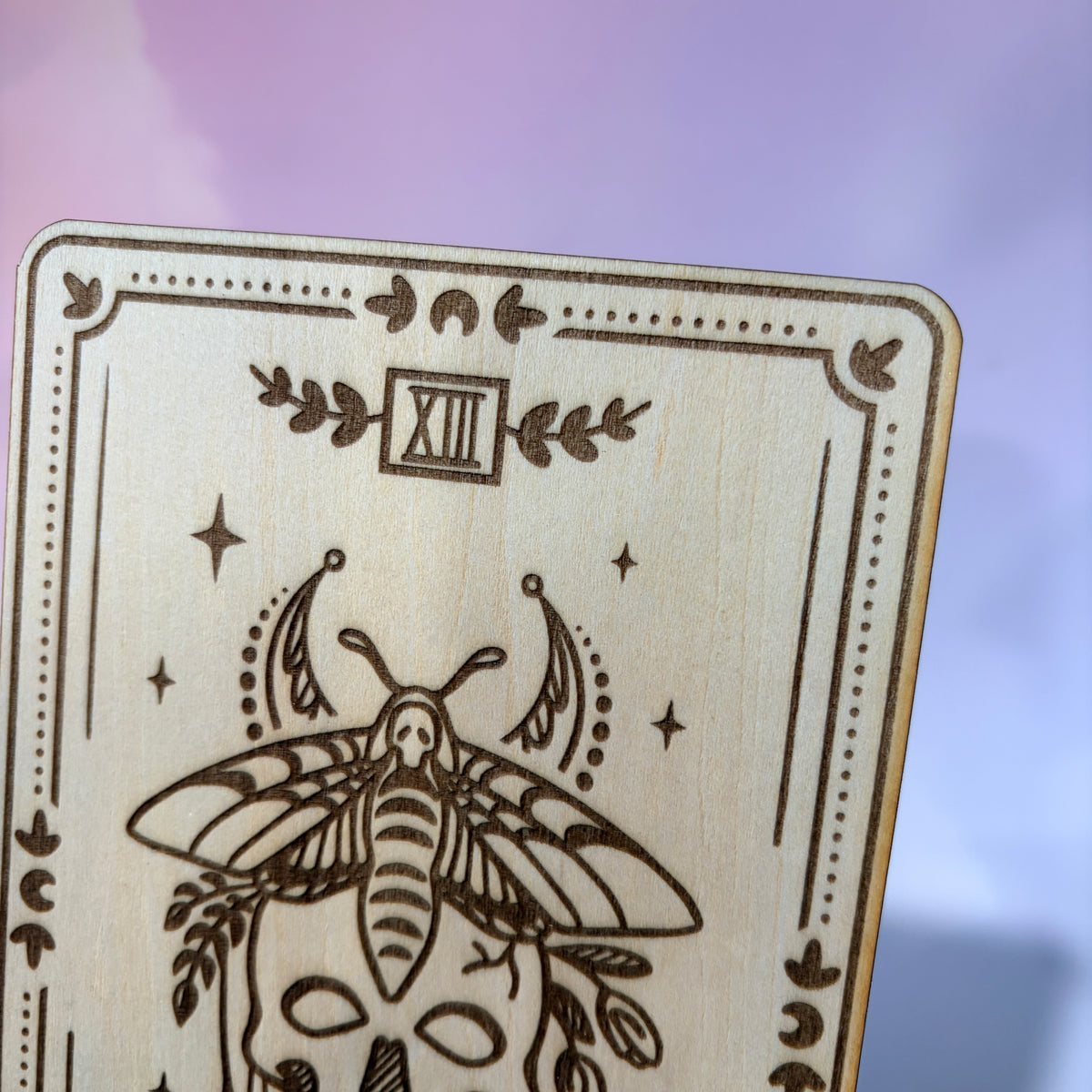 Laser-engraved wooden tarot card made from 3mm basswood, approximately 7 x 5 inches. Available in all 22 Major Arcana designs with customizable colors and an optional display stand for an additional $2.

