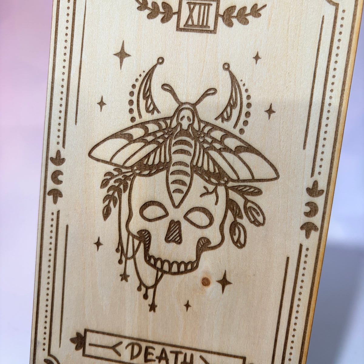 Laser-engraved wooden tarot card made from 3mm basswood, approximately 7 x 5 inches. Available in all 22 Major Arcana designs with customizable colors and an optional display stand for an additional $2.
