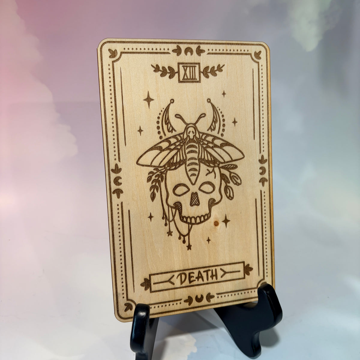 Laser-engraved wooden tarot card made from 3mm basswood, approximately 7 x 5 inches. Available in all 22 Major Arcana designs with customizable colors and an optional display stand for an additional $2.
